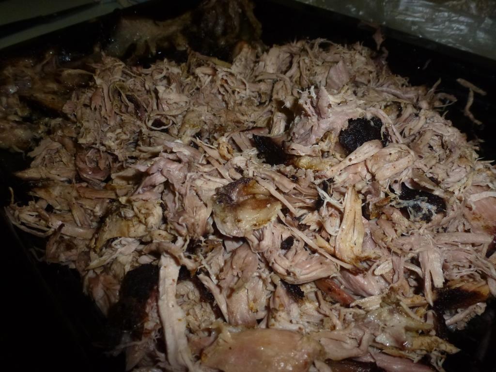 Pulled pork cooked in a meat smoker