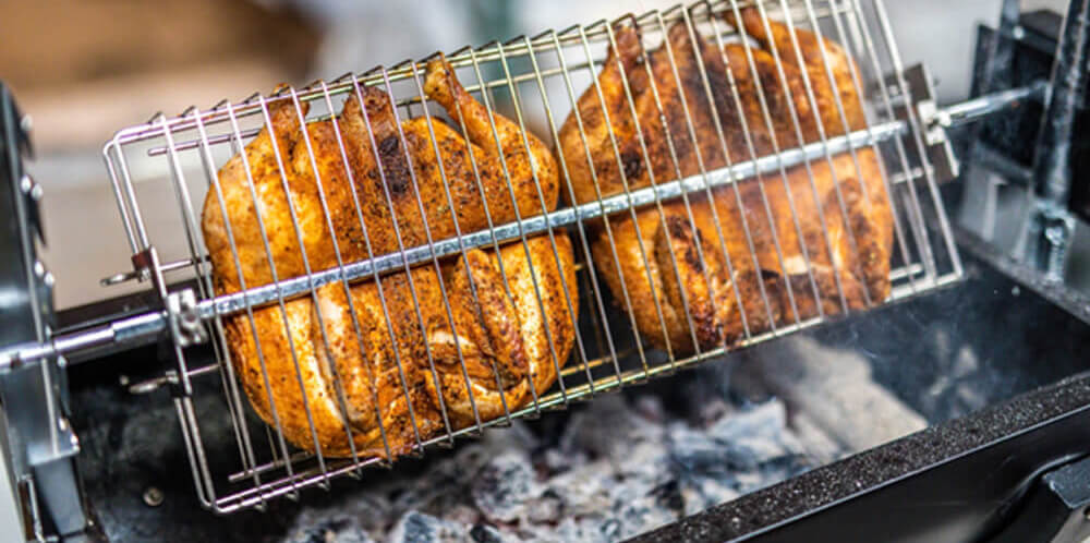 This image shows butterflied chicken and gyros cooked on jumbuck spit roaster