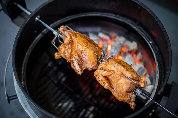 This_image_shows_chicken_being_cooked_on_Kettle_rotisserie_kit