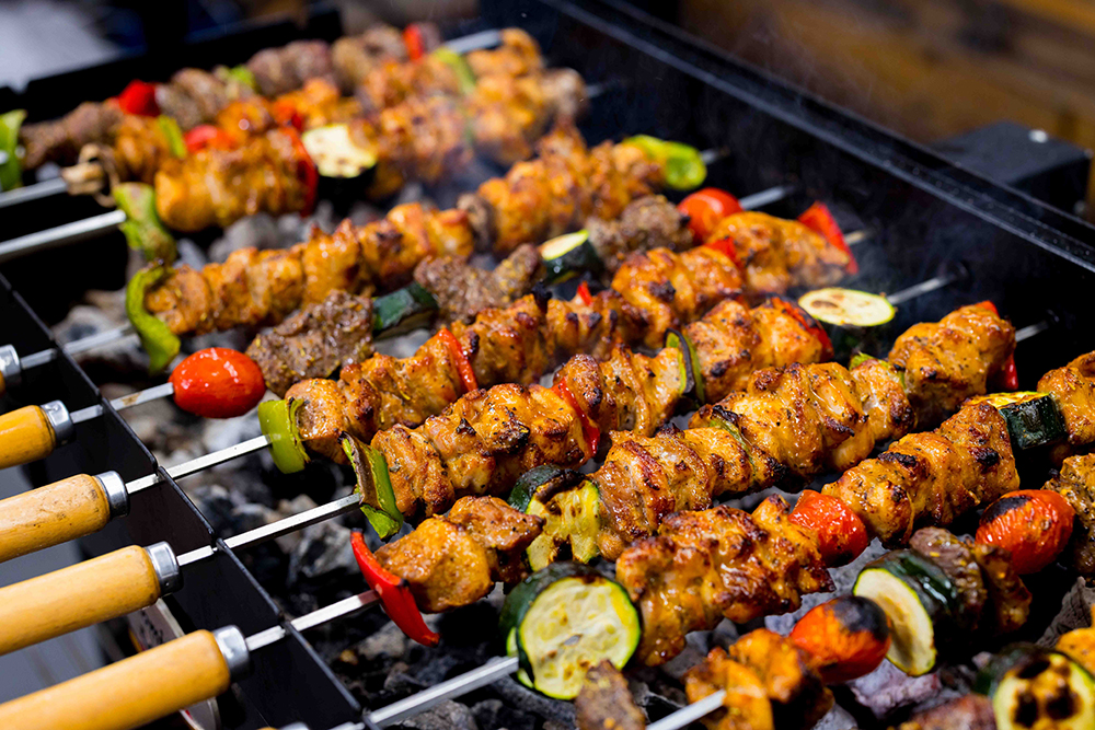 This_image_shows_kebab_skewers_being_cooked_for_12_minutes
