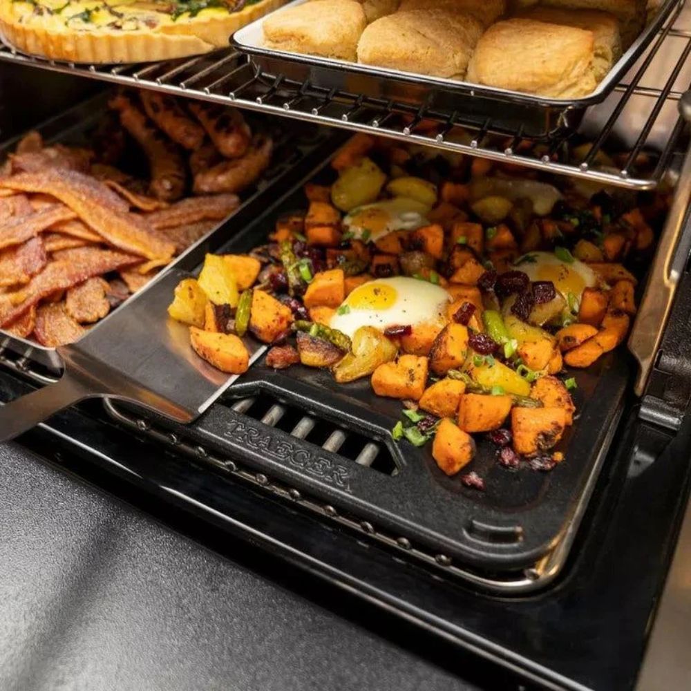 Traeger ModiFIRE reversible cast iron griddle cooking breakfast on pellet grill