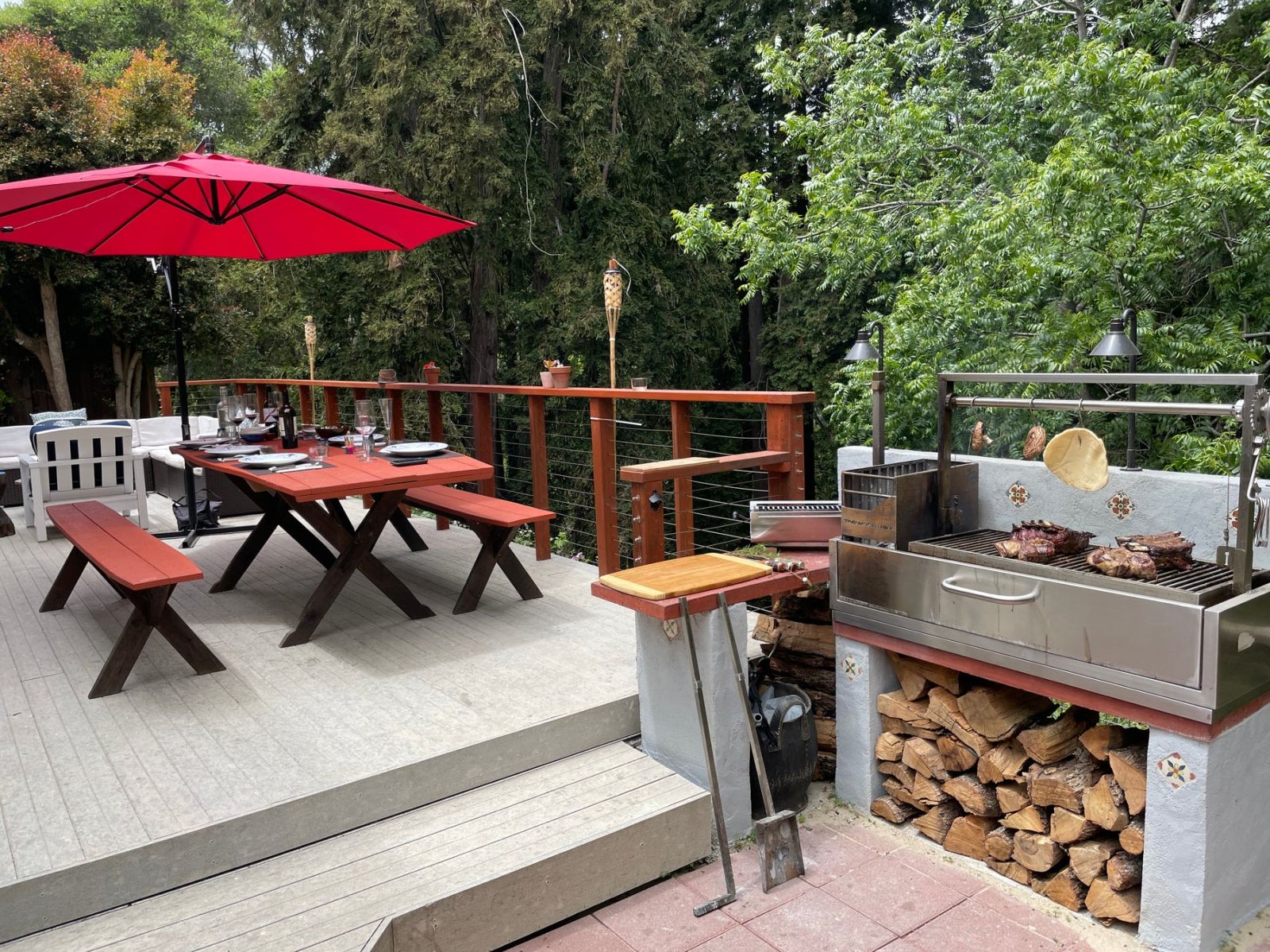 Tagwood Santa Maria Argentine charcoal and woodfired parrilla grill built into outdoor kitchen