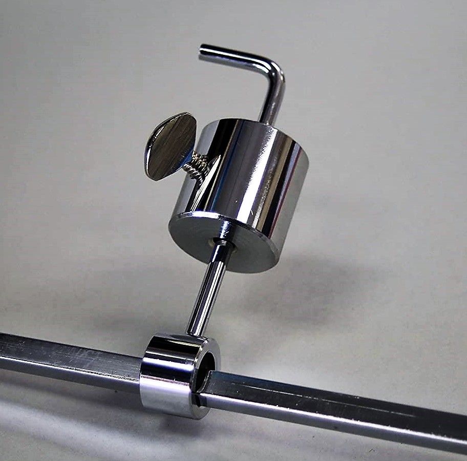 This is a picture showing a spit rotisserie balancing weight connected to an 8mm square skewer.