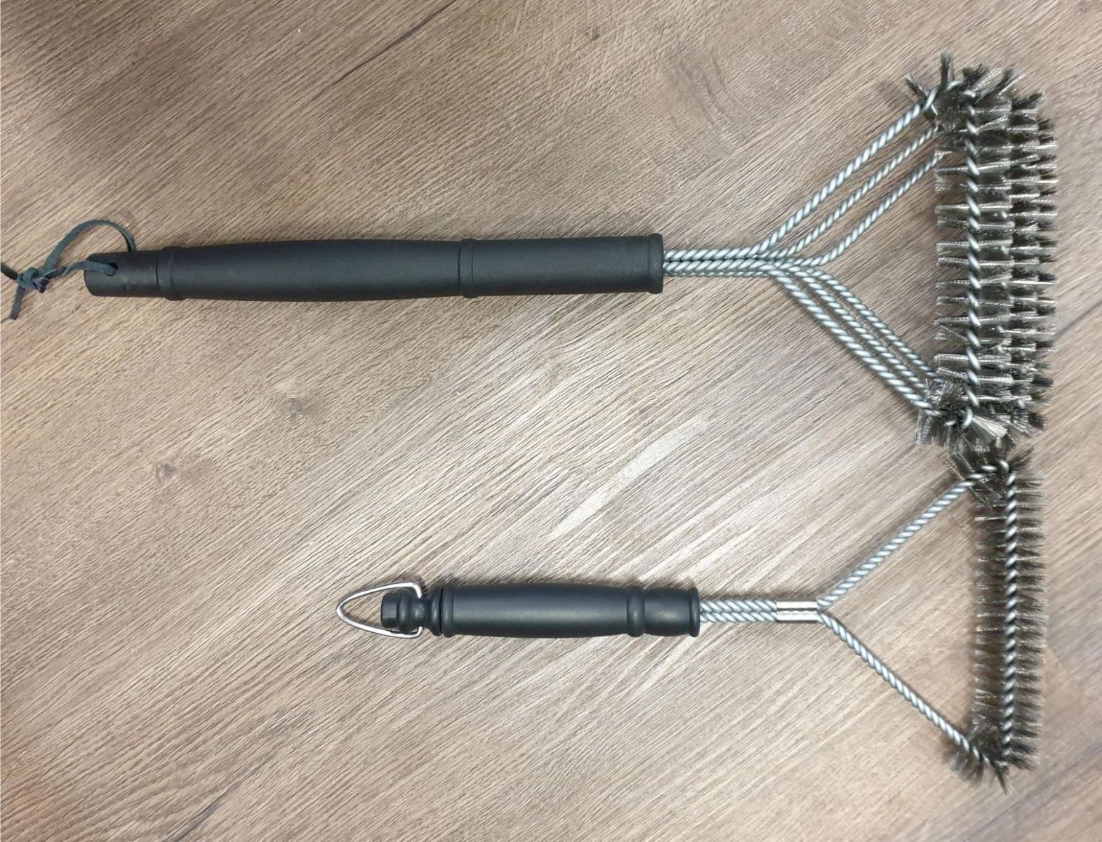 This is a picture comparing your standard BBQ cleaning Brush to the Flaming coals BBQ Grill Brush