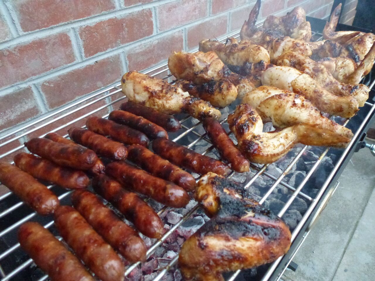 This picture shows how the Cyprus Grill can also be used as a charcoal BBQ with its height adjustable grill