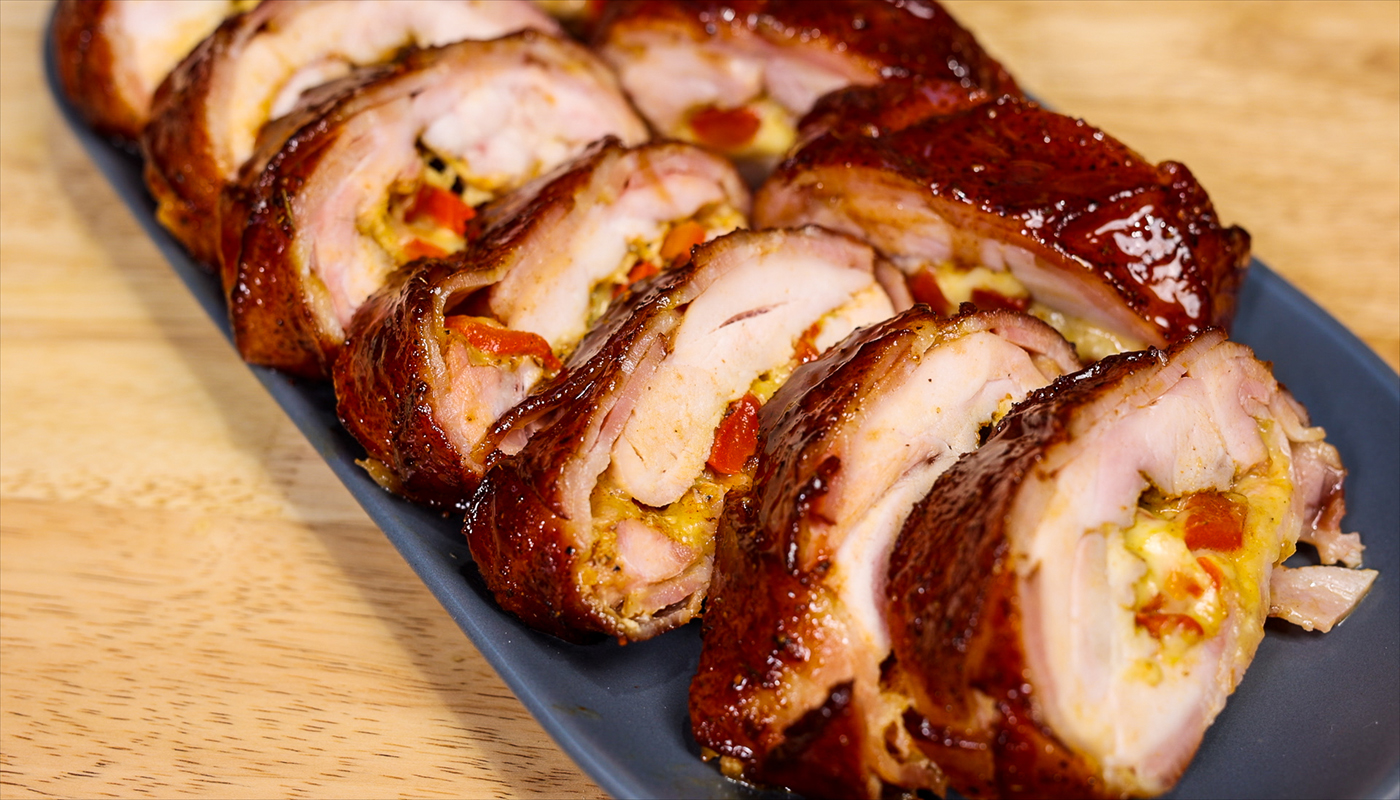 This image shows a sliced Bacon wrapped chicken Fatty. 