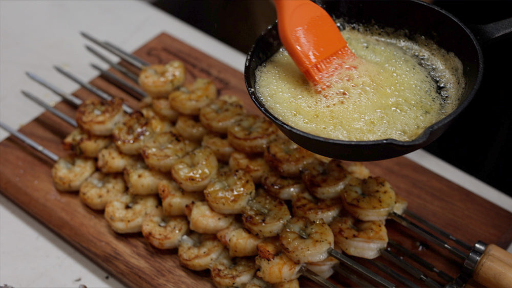 This image shows prawns basted with melted butter