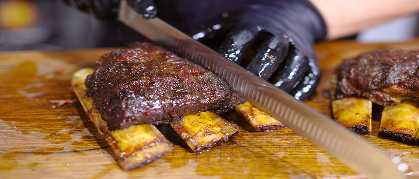 This image shows a man slicing the beef