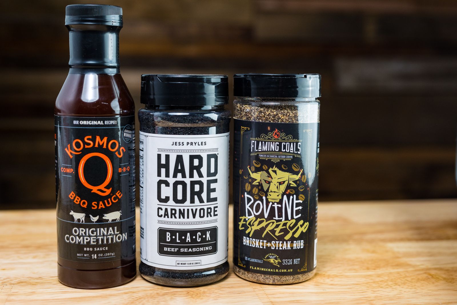 This image shows Kosmos Q Bbq Sauce, Hard Core Carnivore Beef Seasoning and Flaming Coals Bovine Espresso Rub