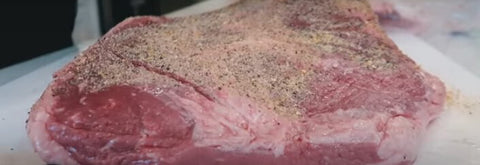 This photo shows a Brisket Marinated with SPG Rub and Texas Beef Rub