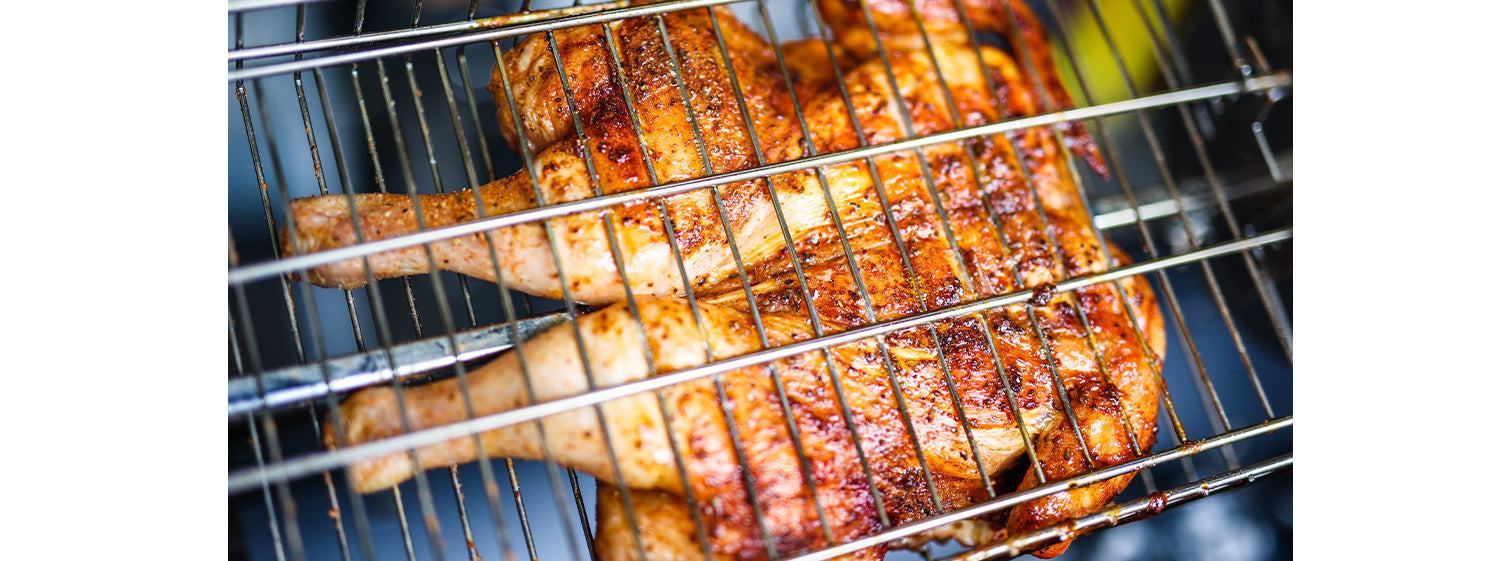 Butterflied chicken on a jumbuck spit