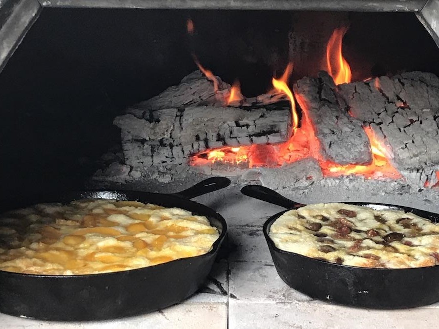 Cooking in a pizza oven with 3 cast iron pans