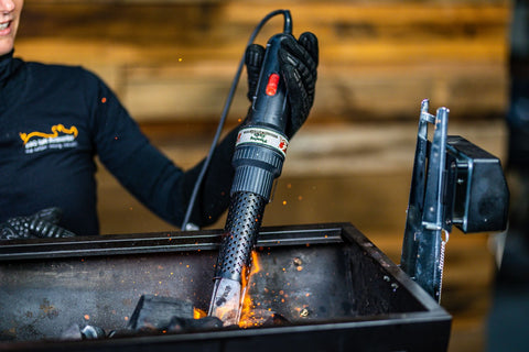 This_image_shows_charcoal_starter_wand_being_used_to_lit_charcoal