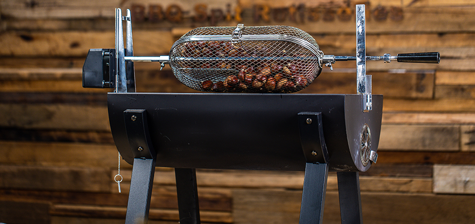 This image shows chestnuts cooked on a spit rotisserie