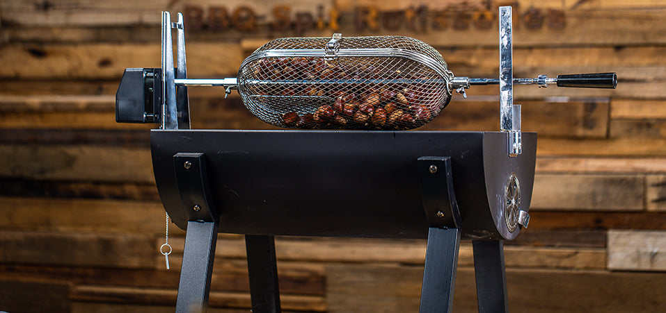 This image shows chestnuts cooked on a spit rotisserie This image shows chestnuts cooked on a spit rotisserie