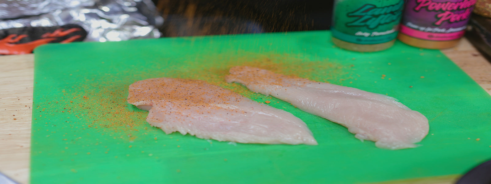 This image shows chicken breast seasoned with Slow Burner Chicken Charger Rub