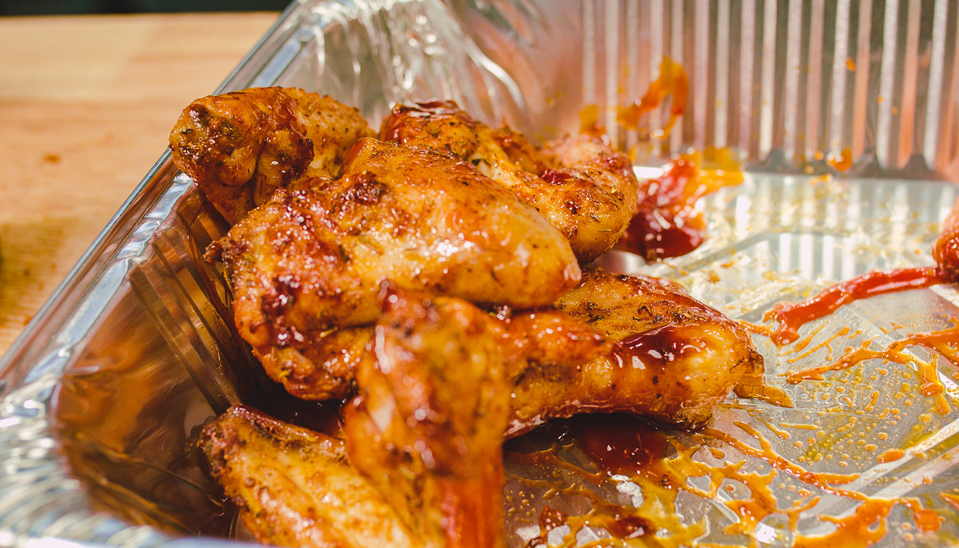 This image shows chicken wing with Flaming Coals hot bbq sauce