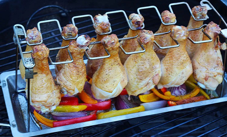 This picture shows the chicken drumstick rack loaded with cooked chicken legs that were cooked in a BBQ