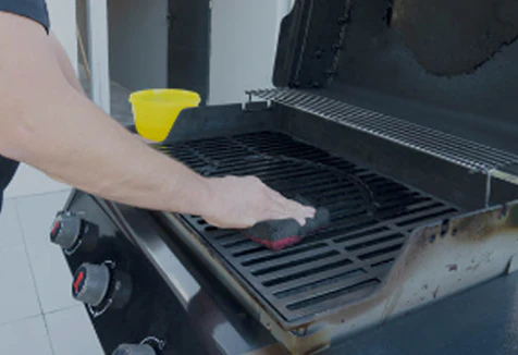 This_image_shows_cleaning_the_inside_of_bbq