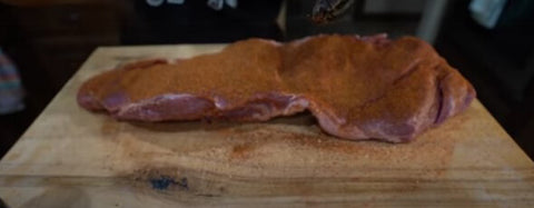 This photo shows a coated pork with Dirty Bird Hot and SPG