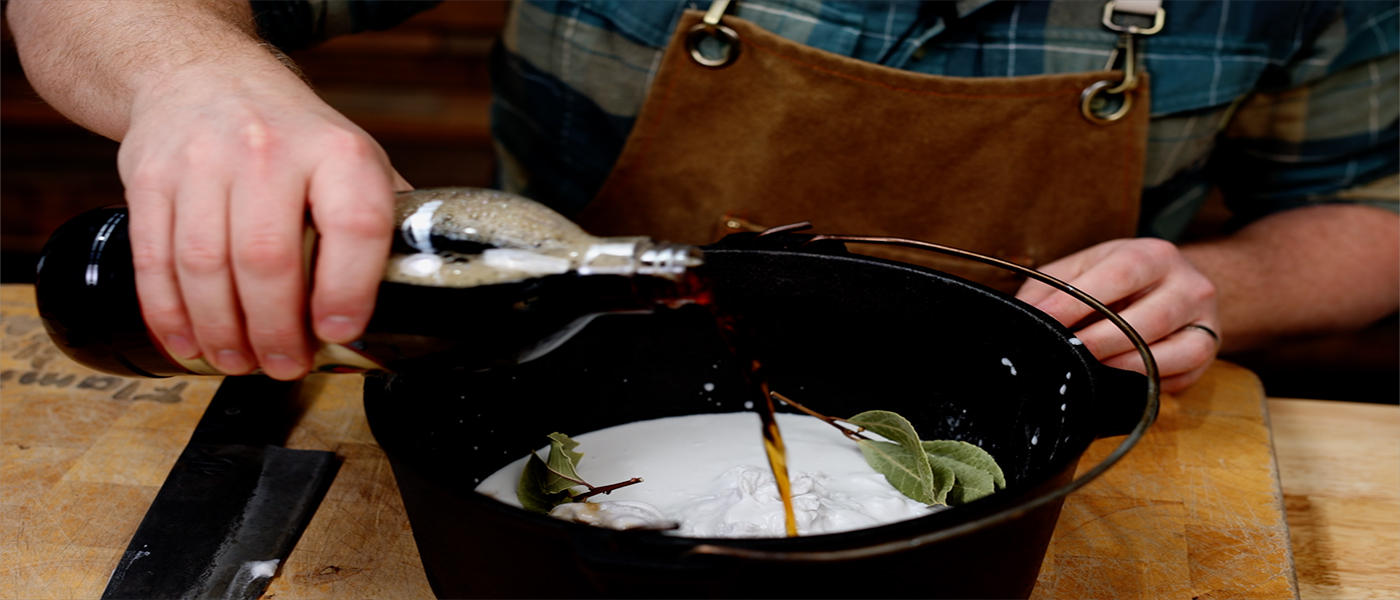 This image shows the Flaming Coals dutch oven with coconut milk inside