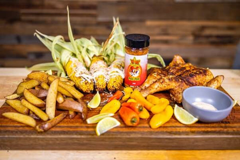 This image shows Corn, vegetables, and Delicious Chicken cooked in the Peri Peri feast