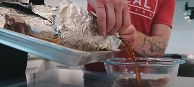 This photo shows how to drain liquid before unwrapping the Brisket