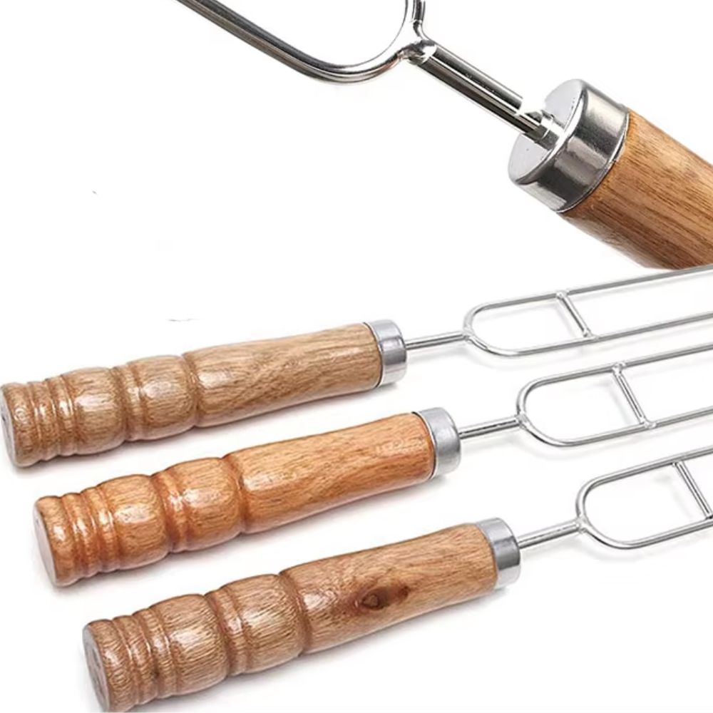 Close-up of Flaming Coals stainless steel U-shape skewers with polished wooden handles, designed for grilling meat and vegetables.