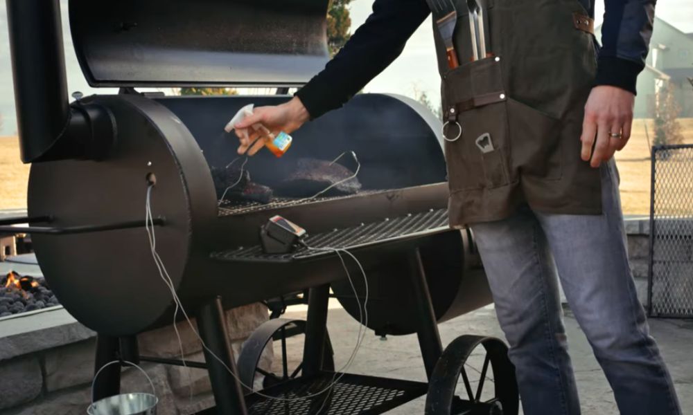 Fireboard 2 Drive wireless thermometer monitoring multiple meats on offset smoker during low and slow barbecue cook