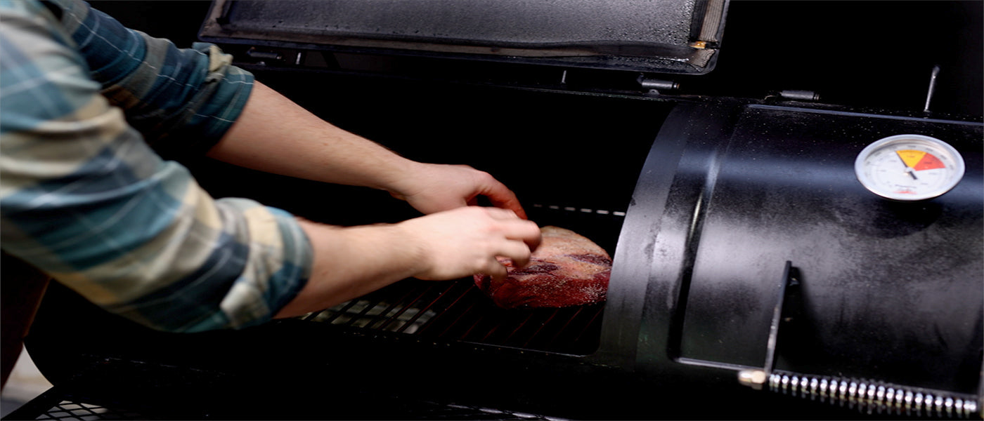 This image shows a rump cap on Flaming coals offset smoker