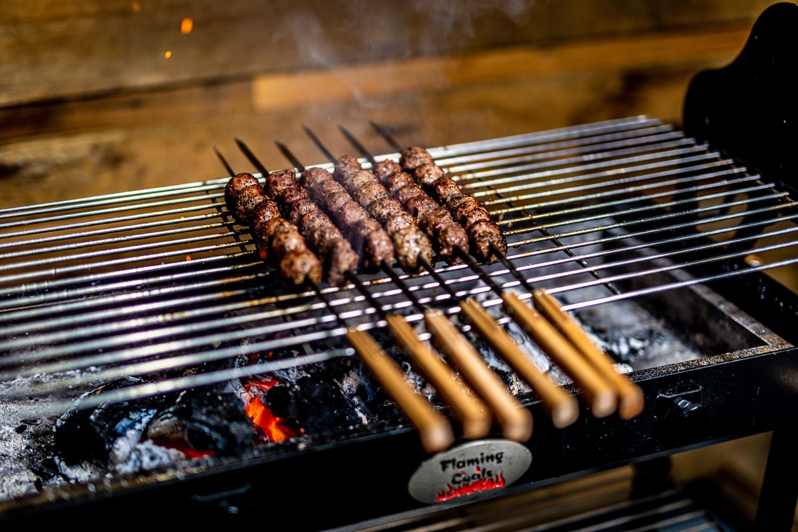 This image shows meatballs being cooked using our new Flat metal Kebab skewer