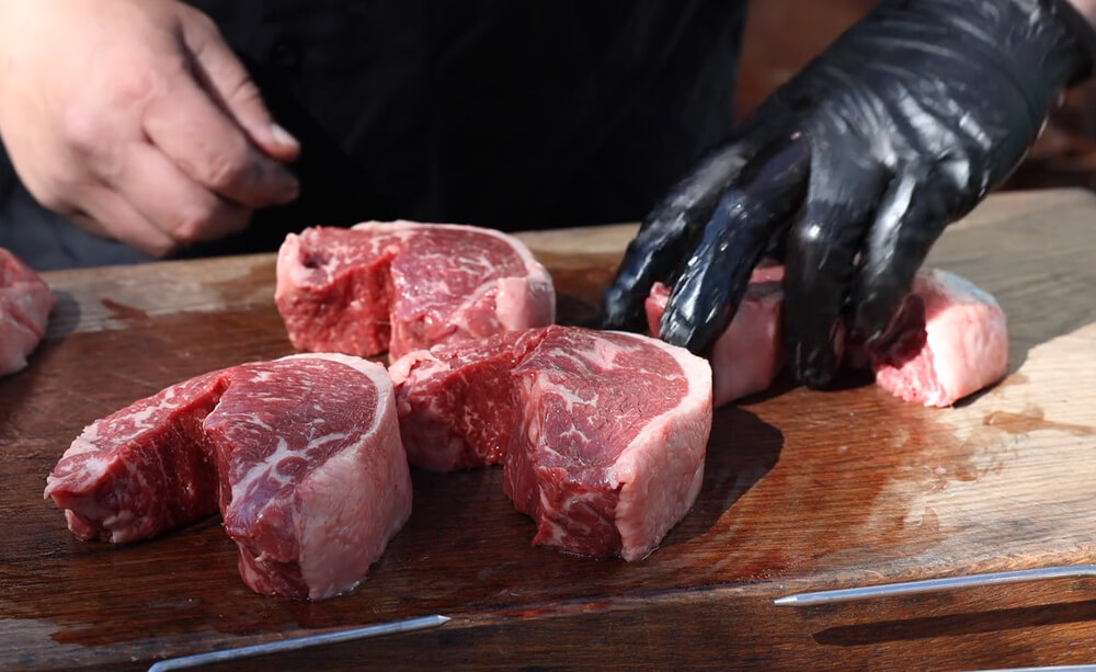 This image shows steaks being moulded into into little bridges 
