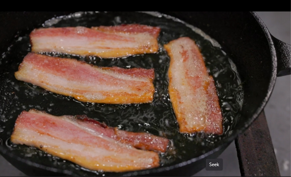 This_image_shows_bacon_being_fried