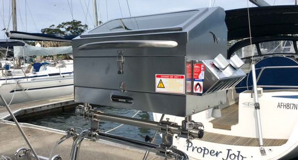 This is a picture of the Galleymate Boat BBQ mounted on a rail at the back of a boat