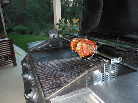 Another_picture_of_beef_being_cooked_in_a_gas_BBQ_on_a_Rotisserie