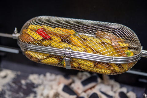 This image shows vegetables being cooked in Flaming Coals rotisserie tumbler cage basket