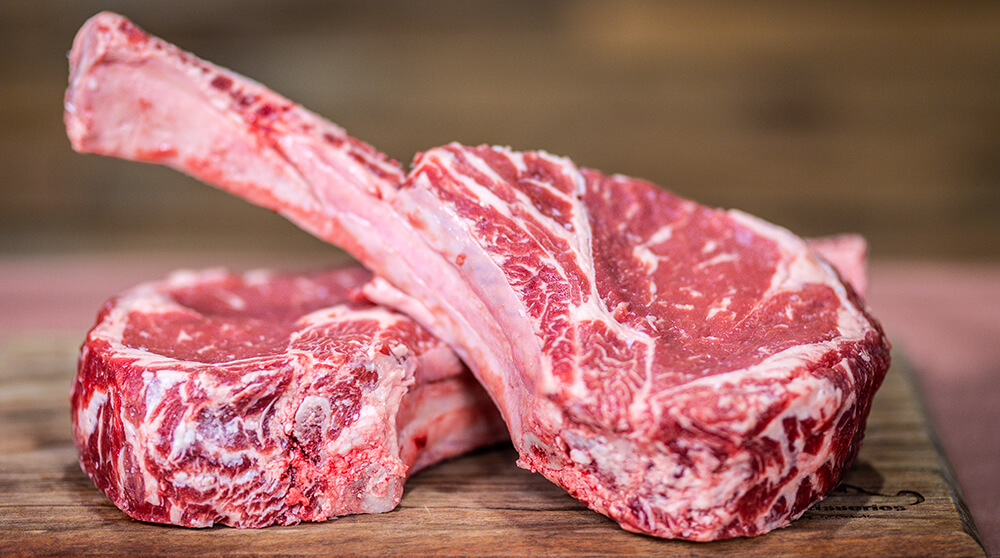 This image shows tomahawk steak resting at room temperature