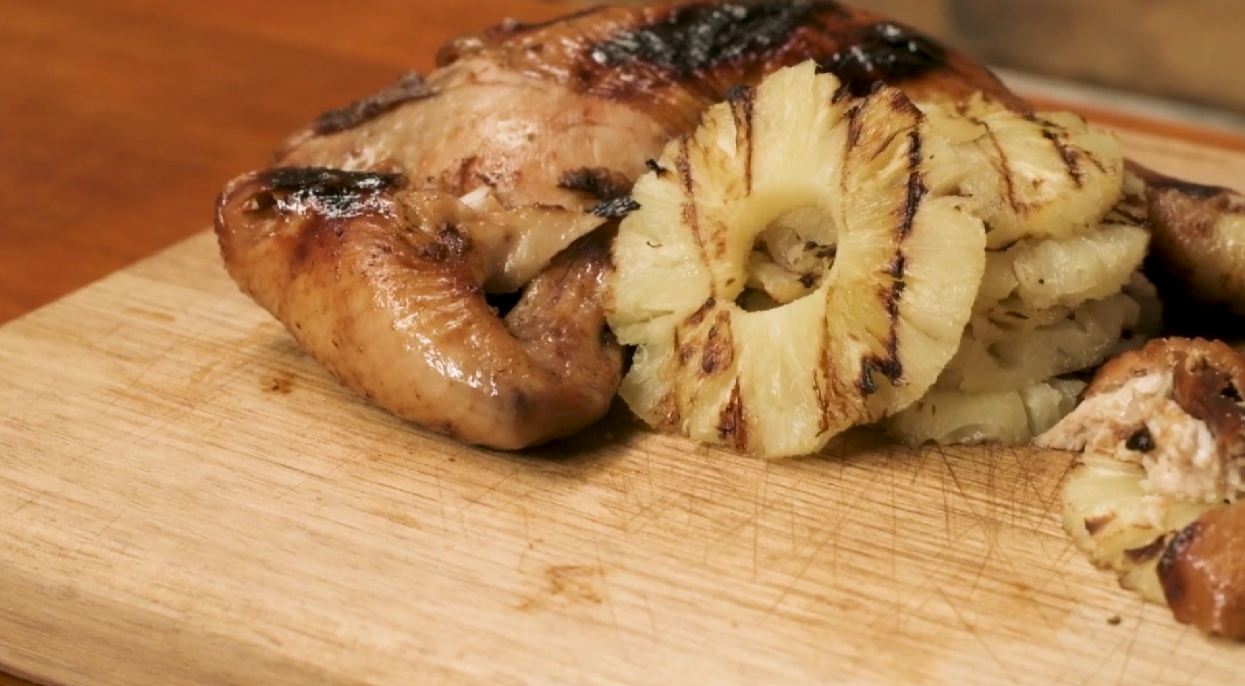 This_image_shows_the_zesty_grilled_chicken_with_pineapples_cooked_on_Argentine_Parrilla_BBQ