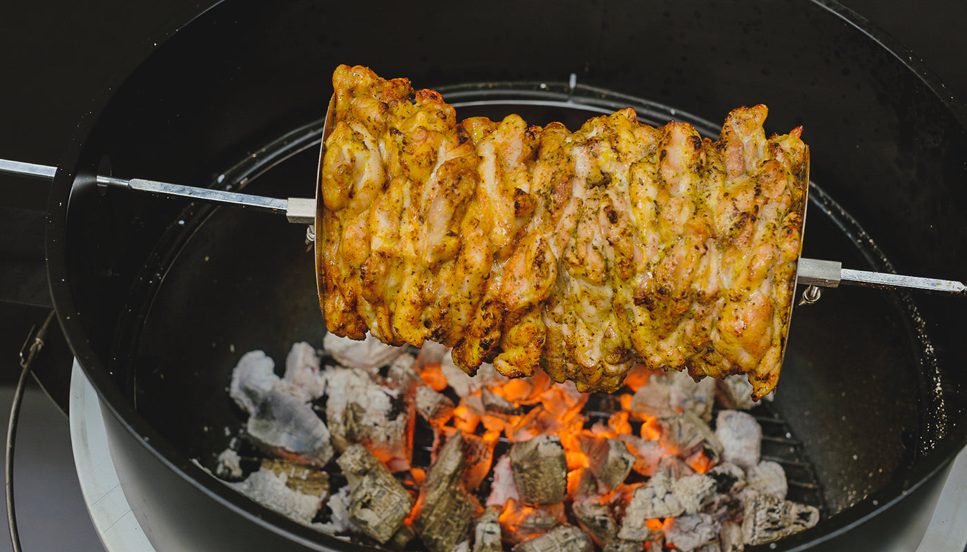 This image shows a gyros perfectly placed on kettle rotisserie kit