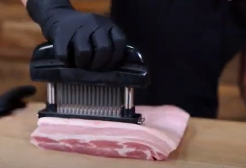 This_image_shows_pork_being_tenderise_with_Jaccard_meat_tenderiser