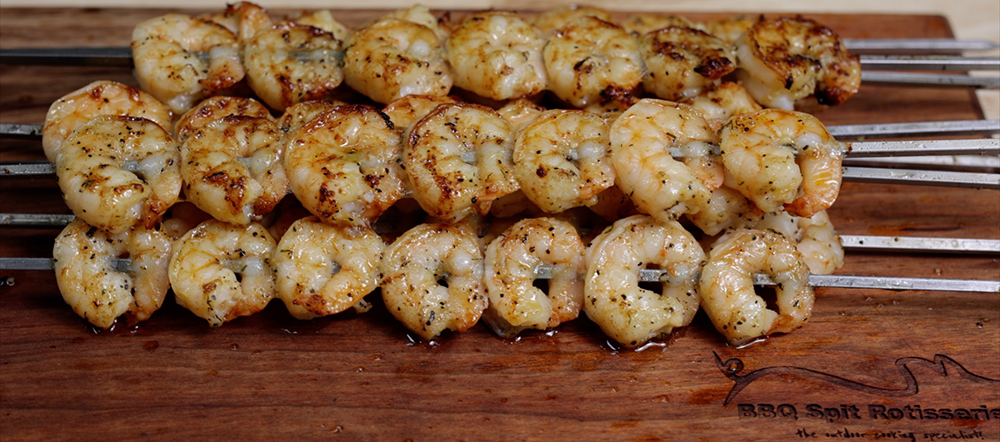 This image shows delicious prawns cooked in Cyprus spit Rotisseries. 