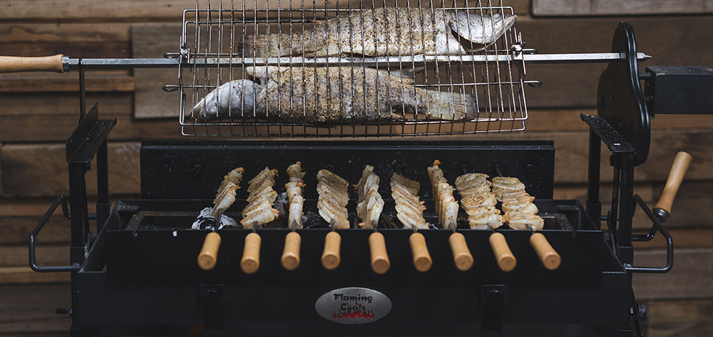 This image shows two Barramundi cooked in Cyprus Spit