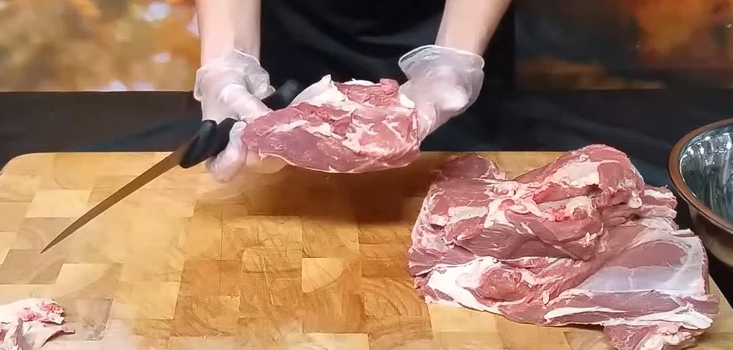 This picture shows the ideal size to cut lamb shoulder for cooking Gyros