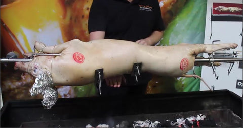 This_picture_shows_how_high_a-spit_should_be_over_hot_coals_by_using_your_hand_as_measurement