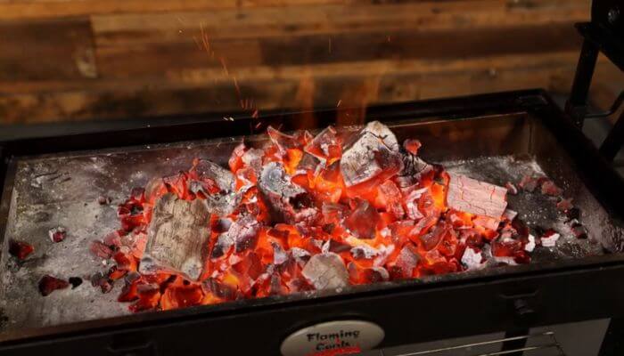 This image shows a lit charcoal bed