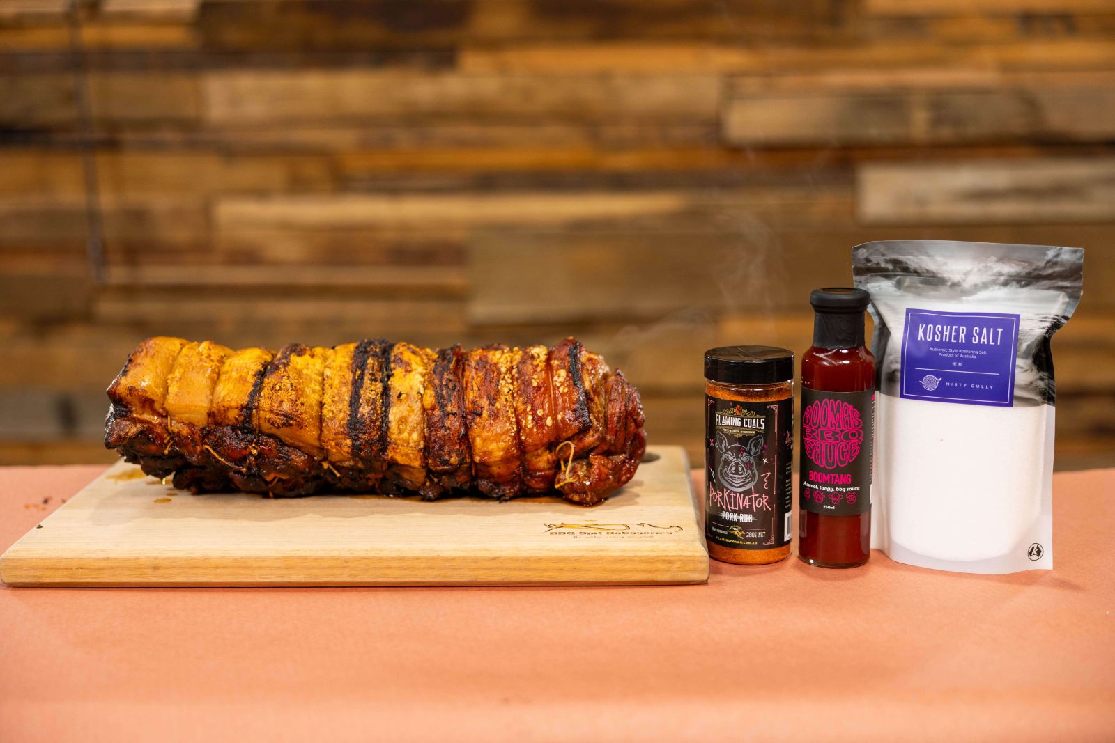 This image shows delicious Porchetta with Porkinator BBQ Rub, sauce and Kosher Salt 