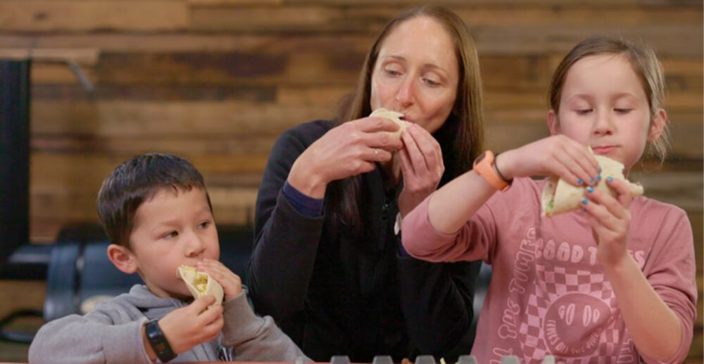 This_image_shows_kids_enjoying_the_tacos