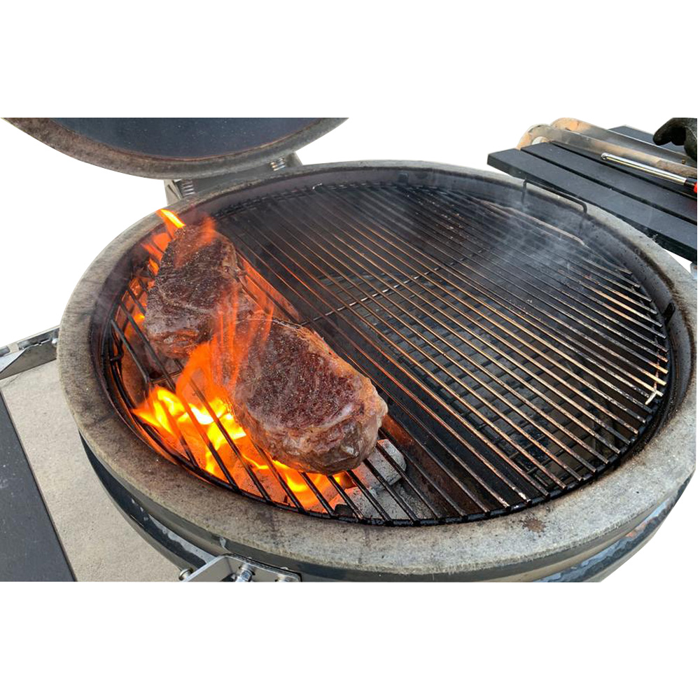 This image shows a kamado with stainless steel elevated cooking grate.