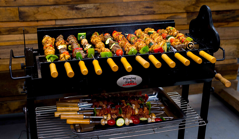 Chicken skewers cooking on a Cyprus Spit Roaster