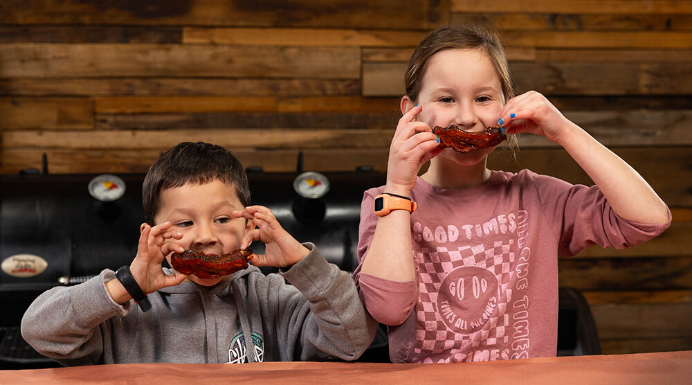 This_image_shows_kids_enjoying_the_left_over_beef_short_ribs